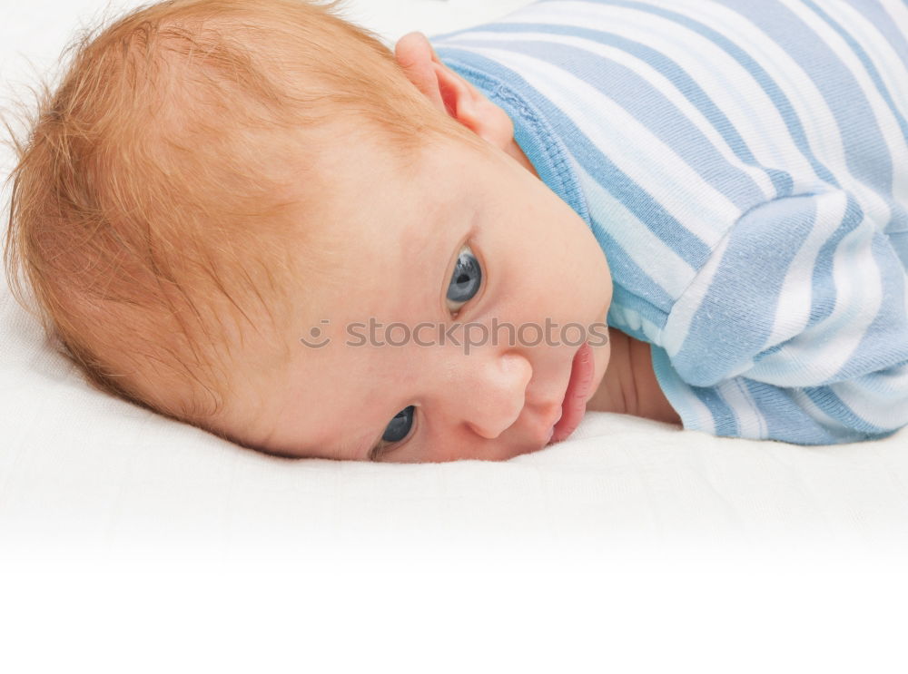 Similar – The back of a baby’s head lying on its stomach