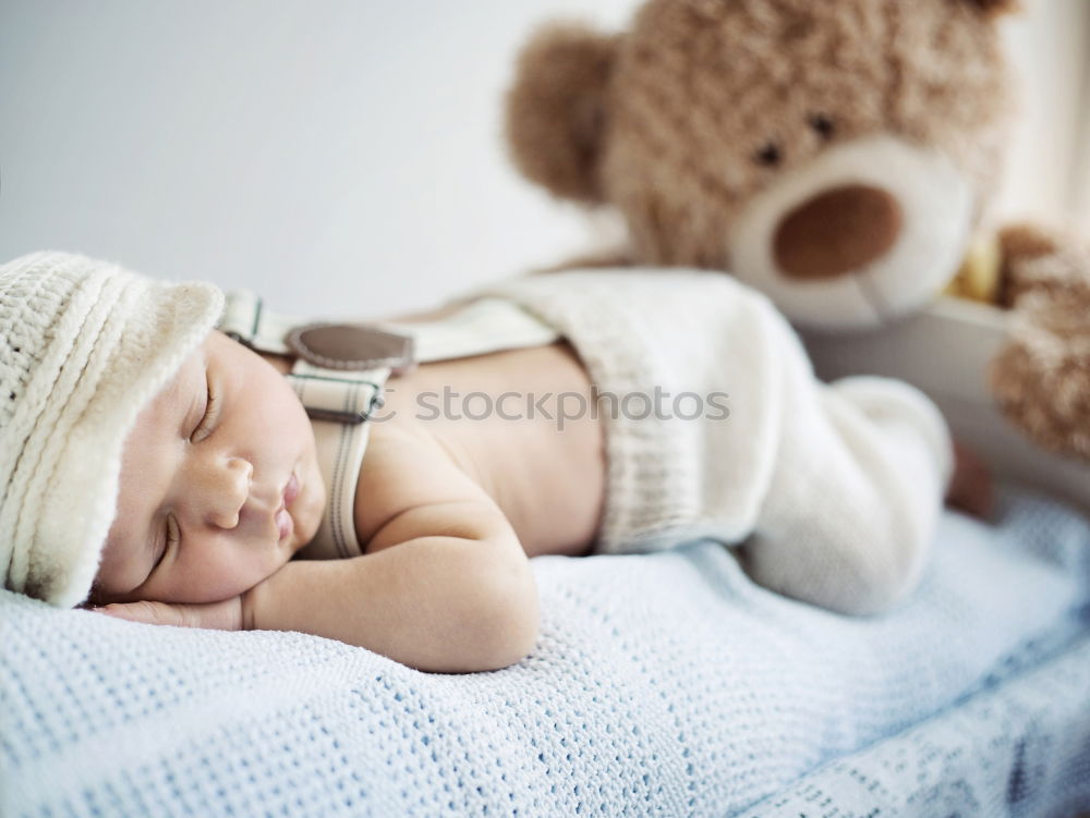 Similar – Baby sleeping on a blanket