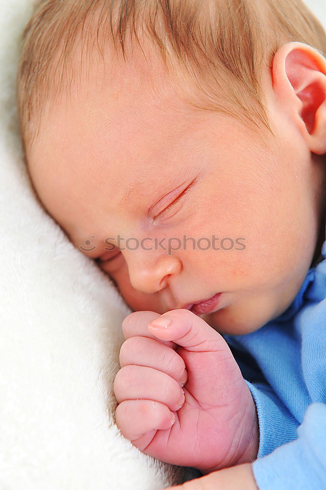 Similar – Adorable baby sleeping wrapped in a red blanket