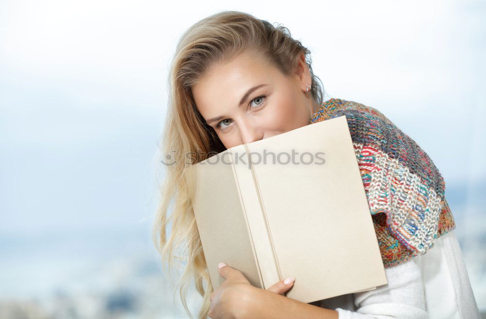 Young female student in reading glasses