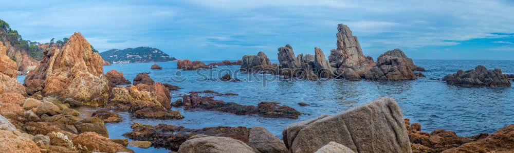 Rugged coast in the blue sea