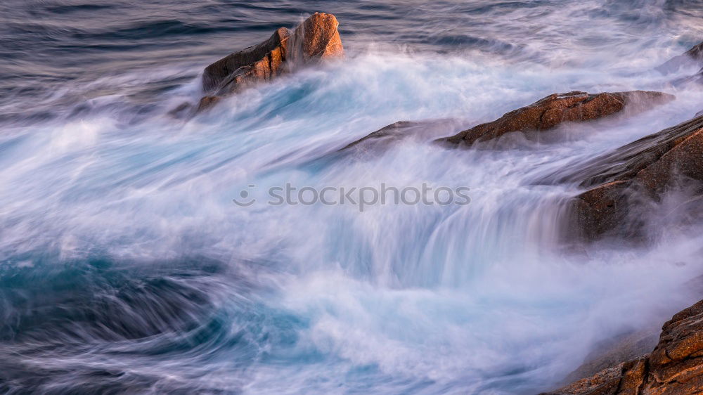 Similar – Rocks with spray in the sunset in Portugal II