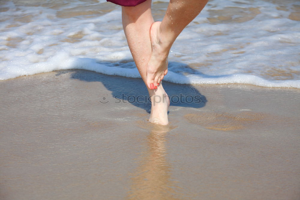 Similar – Man walking on the beach