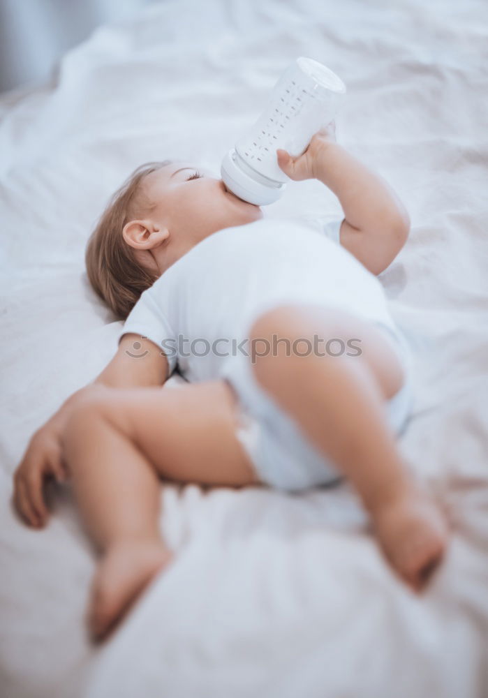 Similar – Image, Stock Photo Newborn baby girl sleeping on blue sheets at home