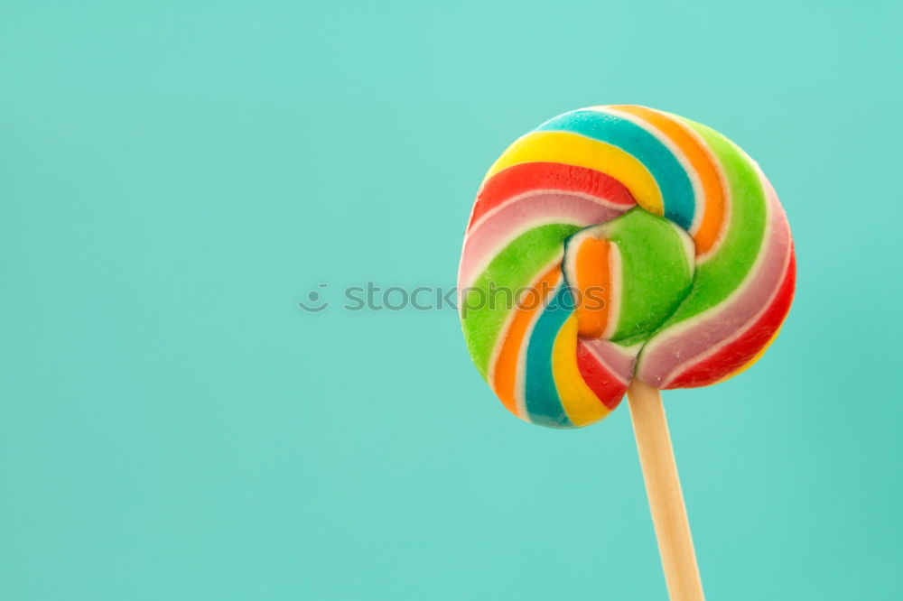 Similar – Colorful lollipop on blue background. Top view. Copyspace