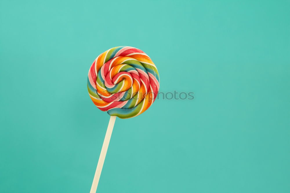 Similar – Colorful lollipop on blue background. Top view. Copyspace