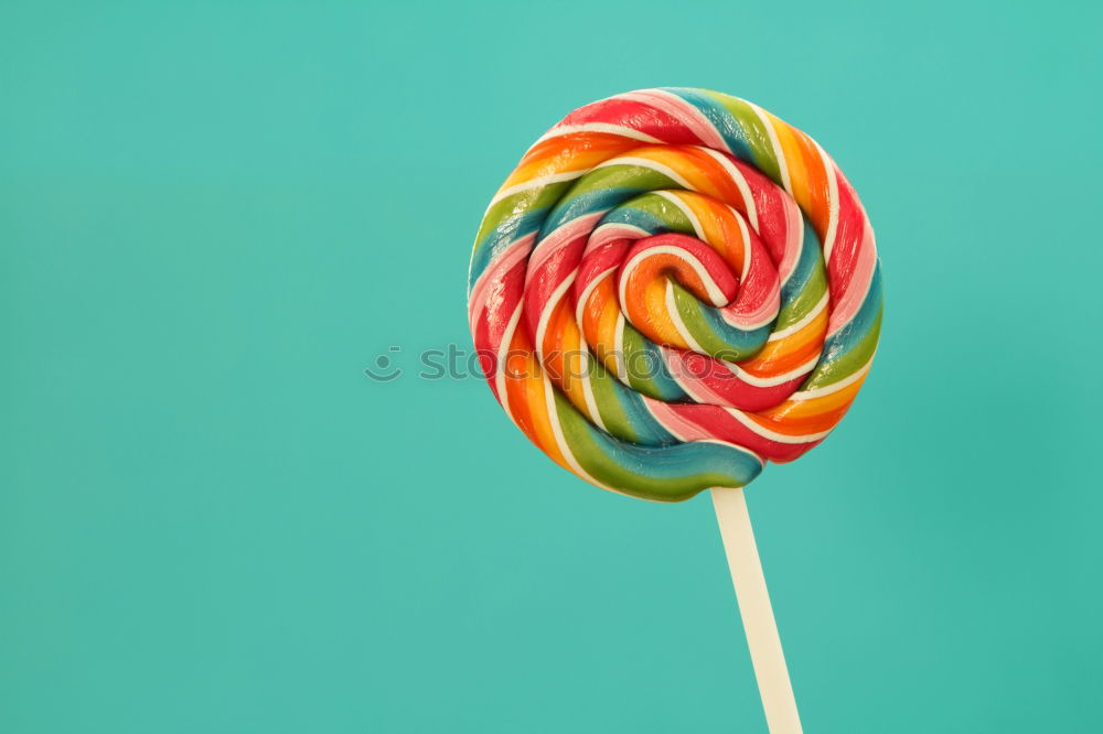 Similar – Colorful lollipop on blue background. Top view. Copyspace