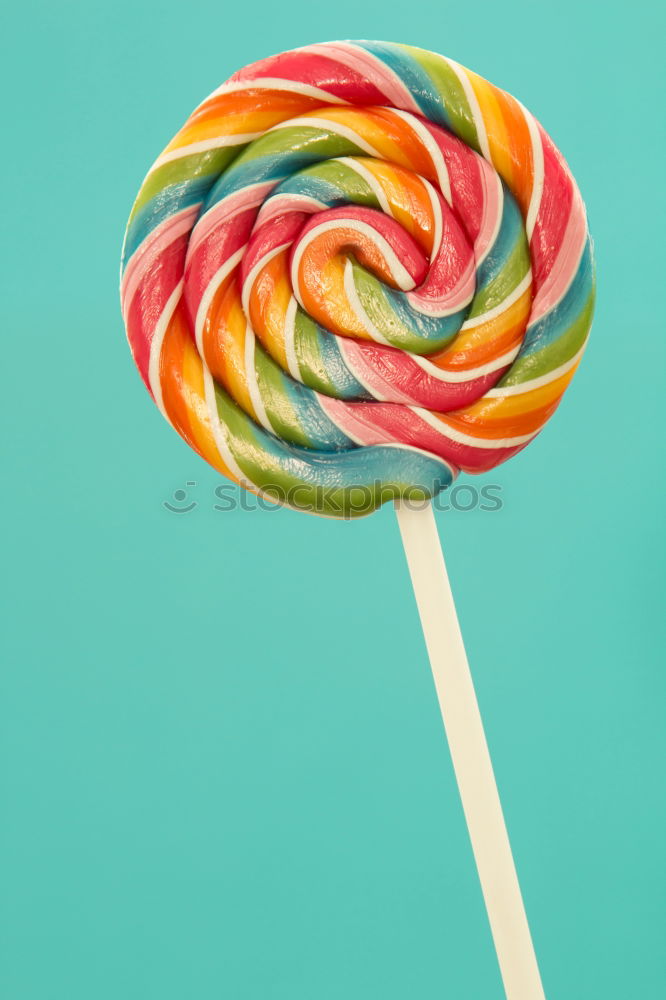 Similar – Colorful lollipop on blue background. Top view. Copyspace