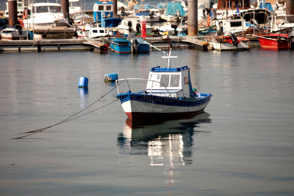 Similar – Fenders suspended between a boat and dockside for protection. Maritime fenders