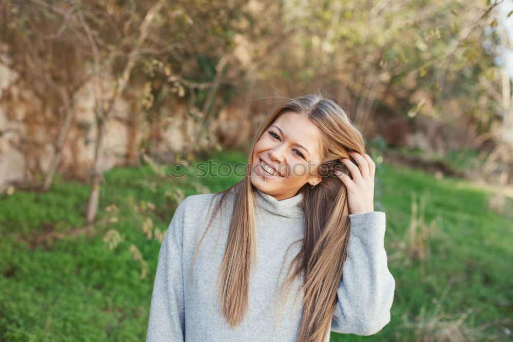 Similar – Beautiful young caucasian woman smiling in steps