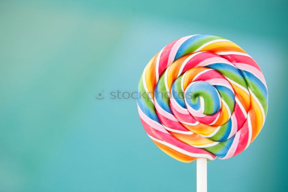 Similar – Colorful lollipop on blue background. Top view. Copyspace