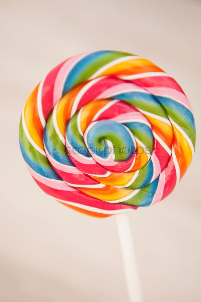 Similar – Image, Stock Photo Colorful lollipops on blue background. Top view.