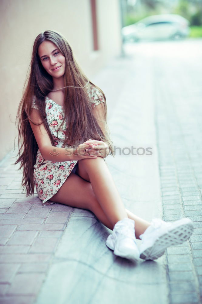 Similar – Happy female riding skate board in street