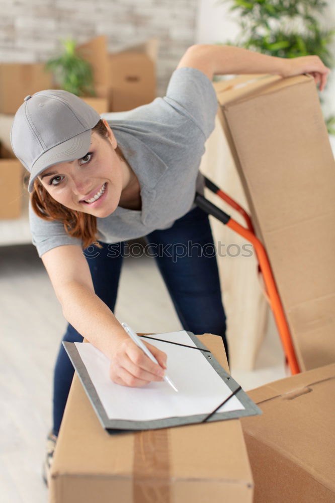 Similar – Man carrying moving boxes