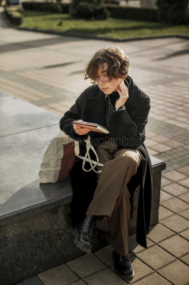 Similar – Attractive businesswoman using smartphone while sitting