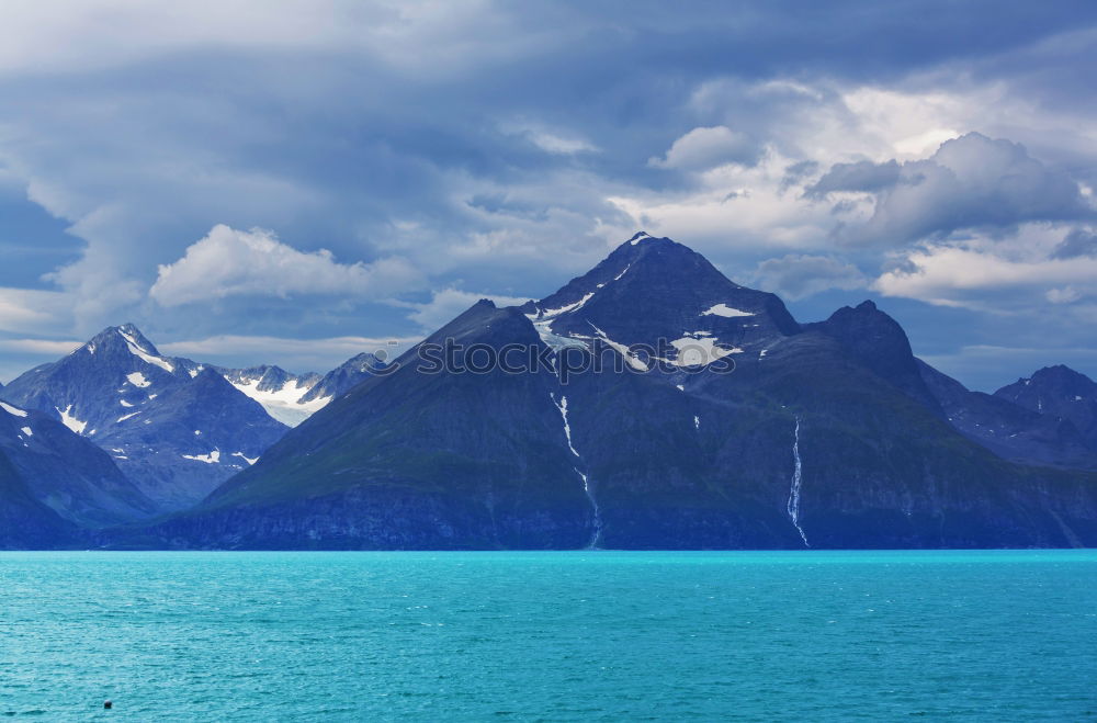 Image, Stock Photo Mountain landscape with a lot of kite surfers and windsurfers moving in a lake. They use the wind to move their boards on the water. Mountains are as background in a sunny day.