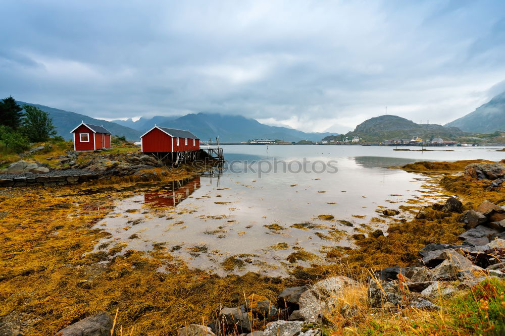 Similar – Small houses on lakeside in mountains