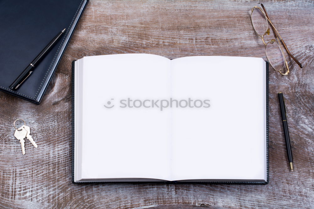 Similar – A woman’s hand holding an empty notebook