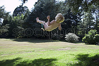 Similar – Child bouncing on a trampoline