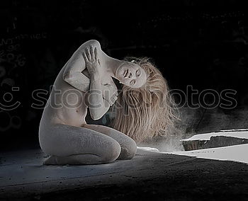 Similar – Sensual model under veil sitting in box