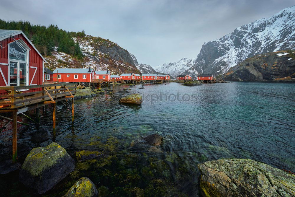 Similar – Small houses on lakeside in mountains