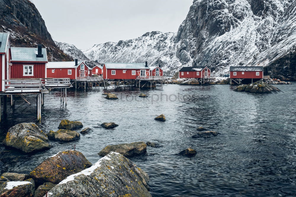 Similar – Small houses on lakeside in mountains