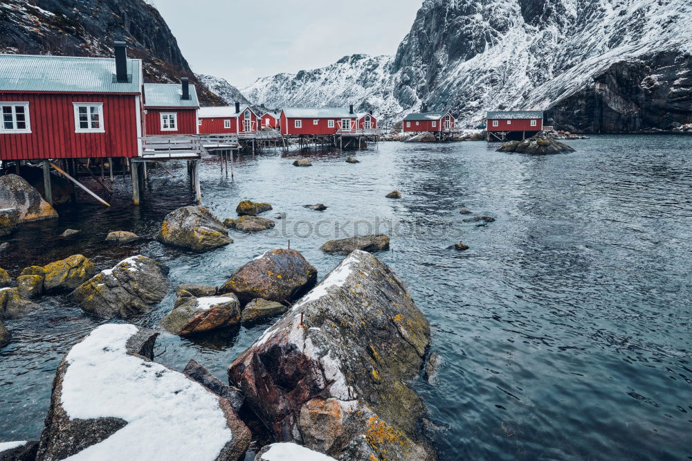 Small houses on lakeside in mountains