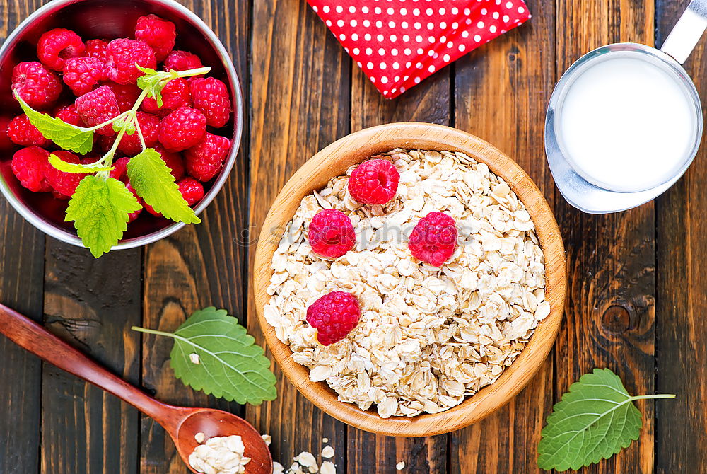 Similar – Oat flakes with berries and spoon