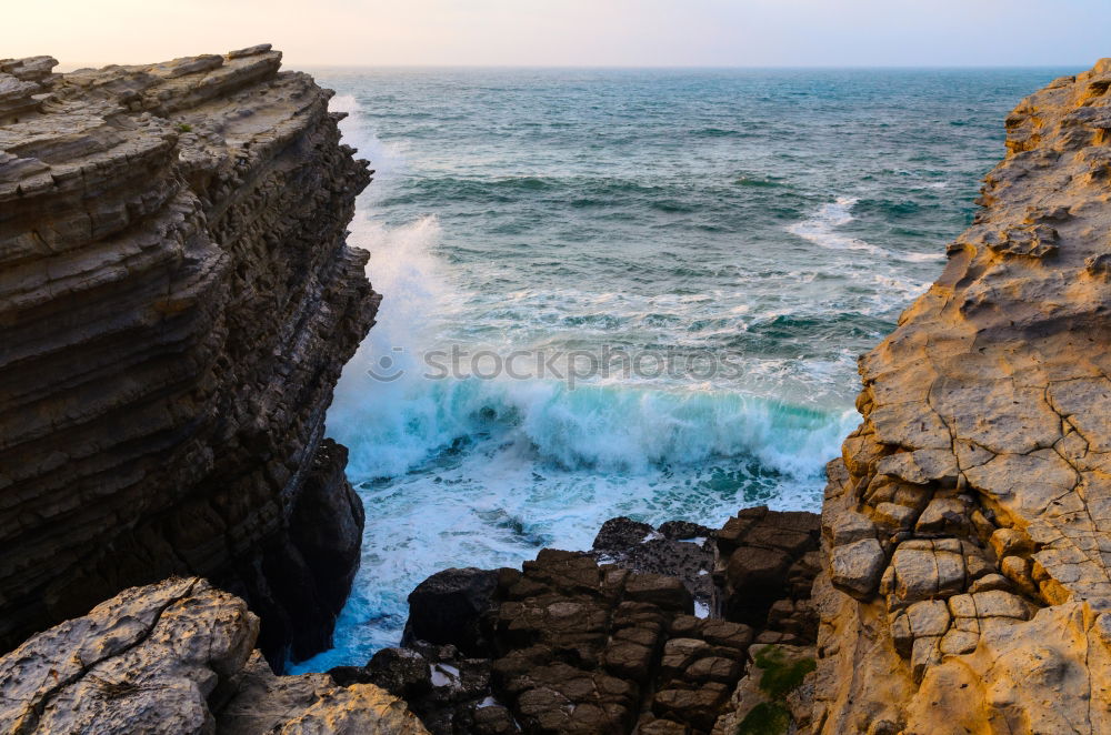 Similar – A lot of rocks with a small lighthouse