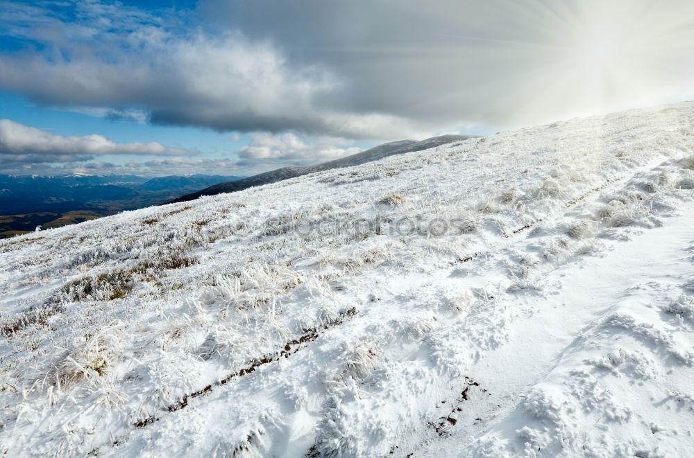 Similar – White peaks of mountains in snow