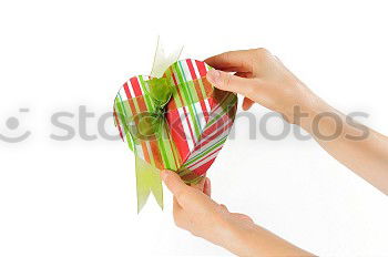 Similar – Young man holding a christmas gift