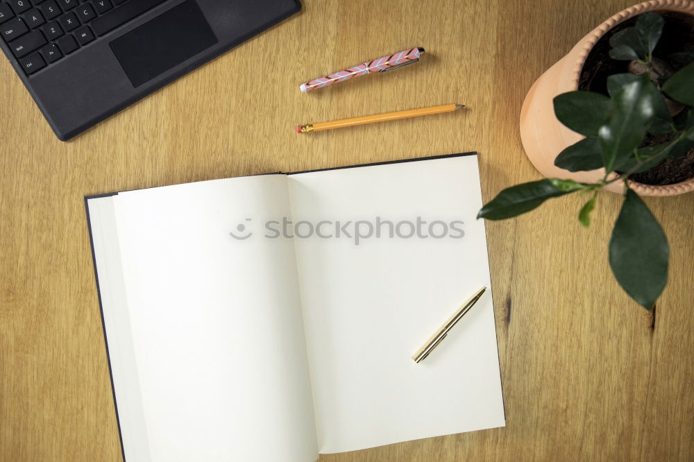 Similar – Green slip of paper with pen, a cup of coffee and a potted plant