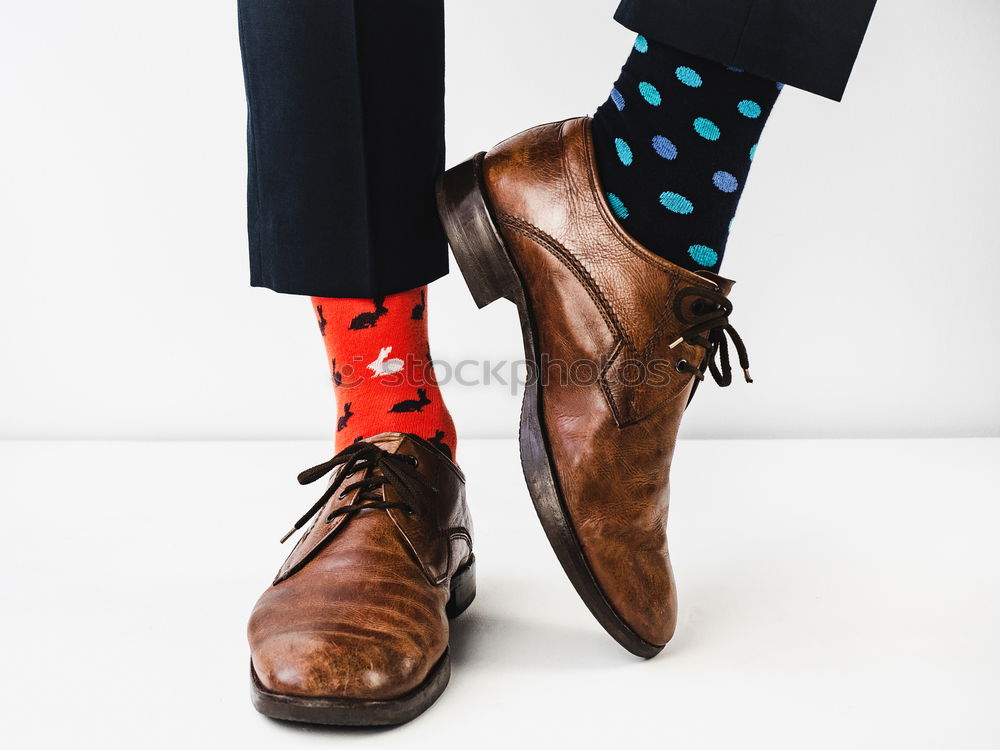 Similar – stylish men’s socks. Stylish suitcase, men’s legs, multicolored socks and new shoes. Concept of style, fashion, beauty and vacation