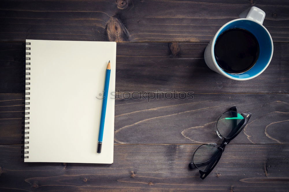 Similar – Blue office: note with pencil, sharpener, paper clips, eraser and a coffee cup