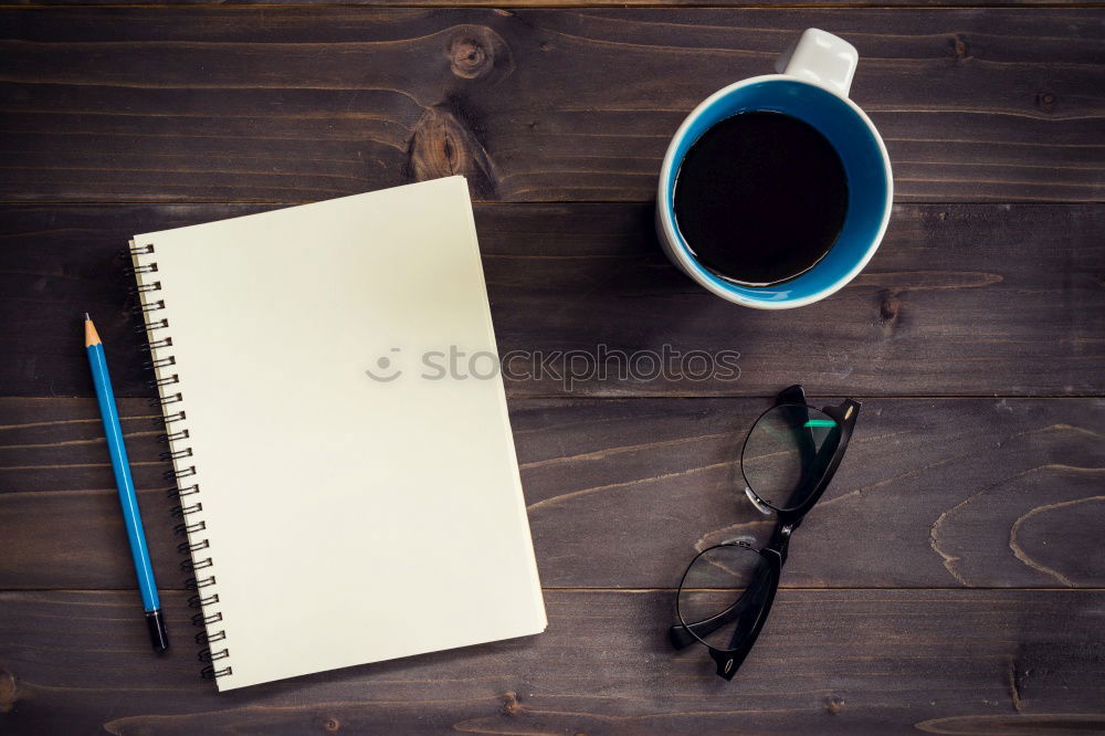 Blue office: note with pencil, sharpener, paper clips, eraser and a coffee cup