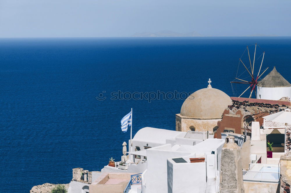 Similar – Image, Stock Photo Idyllic white houses on Santorini with windmills in front of blue sky