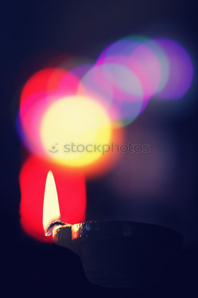 Similar – Image, Stock Photo two red burning candles stand one behind the other in front of a turquoise background