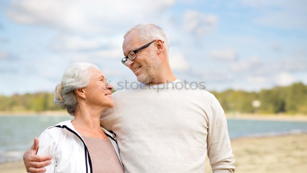 Similar – Grandfather With His grandson on the lake. Back view