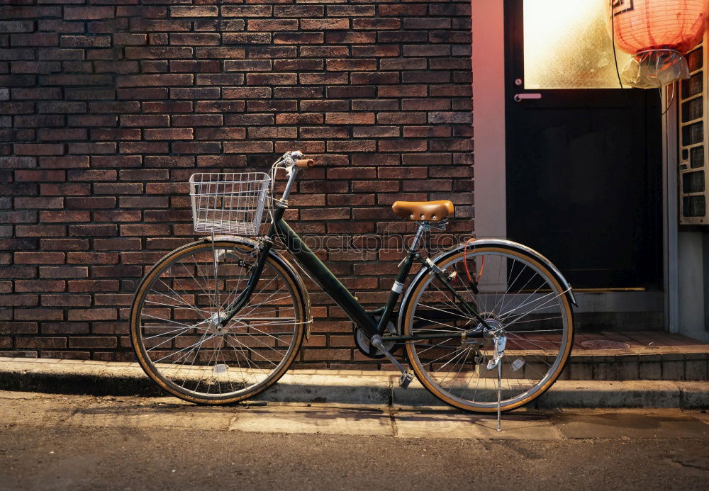 Similar – Image, Stock Photo Classic Holland bike in beige with saddle cover in front of a matching house wall in Cologne on the Rhine in North Rhine-Westphalia