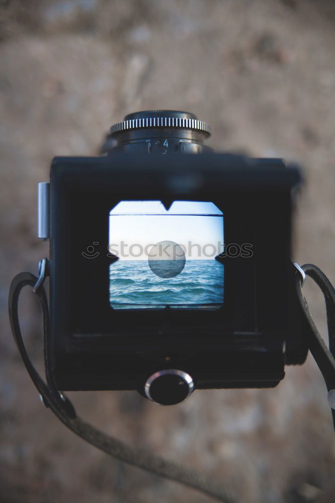 Landscape through the viewfinder of an old camera