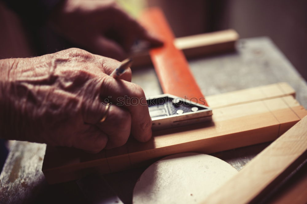 Similar – Craftsman working in his workshop wooden boxes