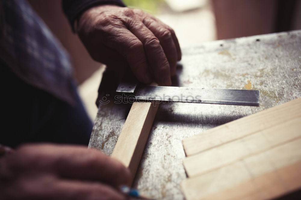 Similar – Craftsman working in his workshop wooden boxes