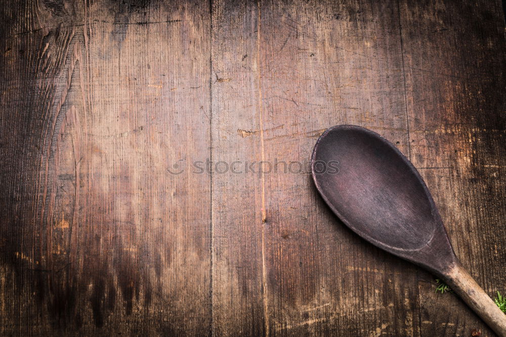 Similar – Black cast-iron frying pan on a brown wooden surface