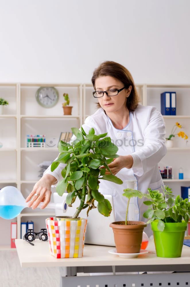 Similar – Image, Stock Photo Woman in work wear in her workshop by table with handmade items