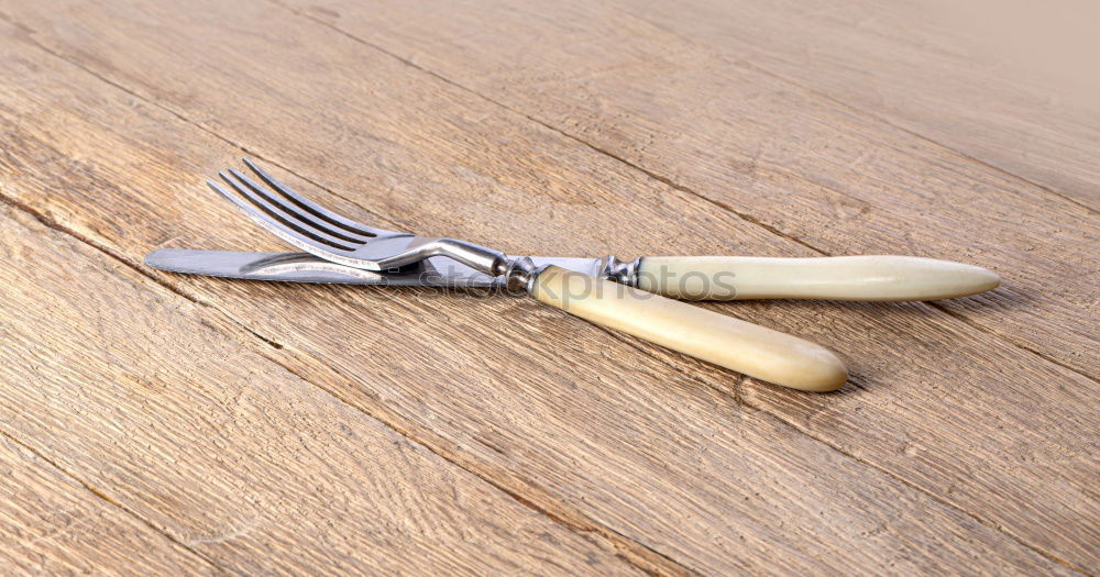 Similar – Old hatchet an a wooden cutting board, top view