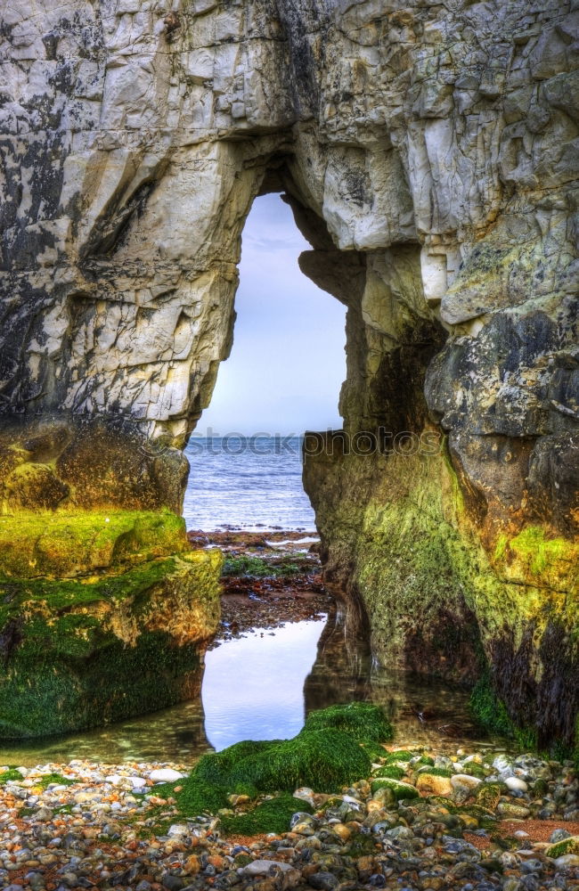 Similar – A Natural Arch on the Coast at Golden Hour