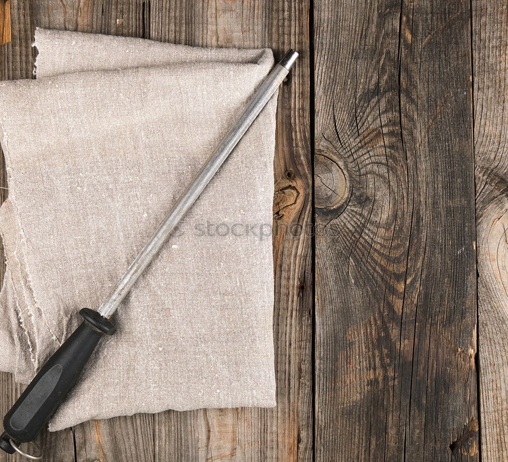 Similar – Grill pan and wooden kitchenware on a brown wooden surface