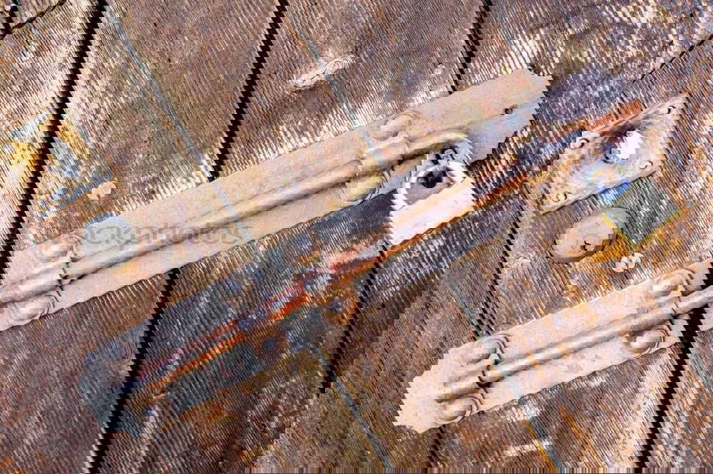 Similar – Image, Stock Photo Old wooden wall of a barn with a simple lock.