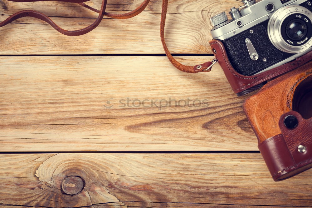 Similar – Image, Stock Photo shoes, notepad, camera, glasses on wooden desk