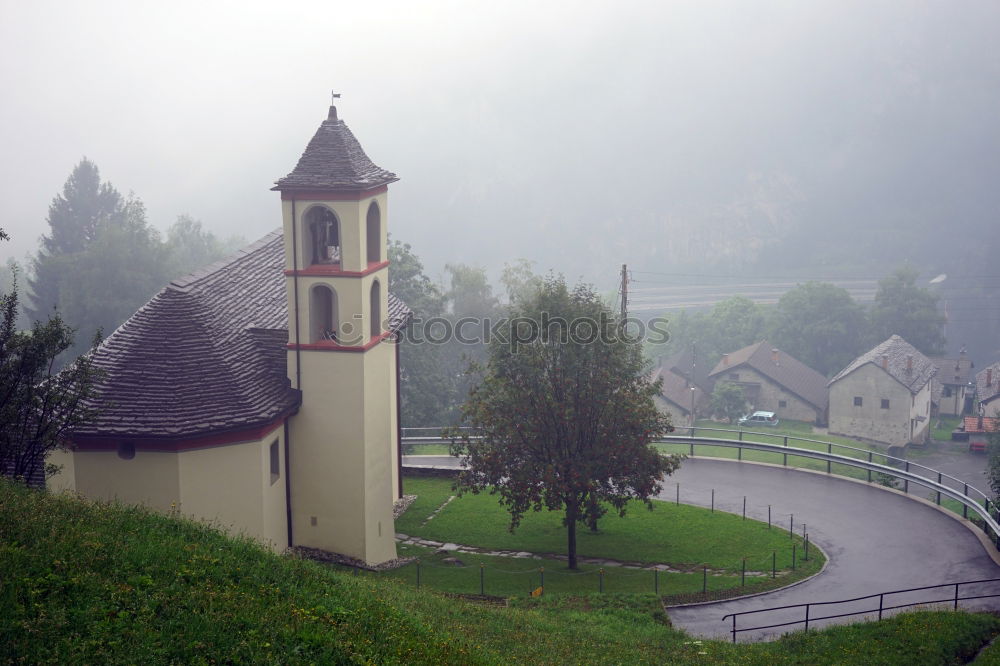 Similar – Church tower in front of foggy landscape